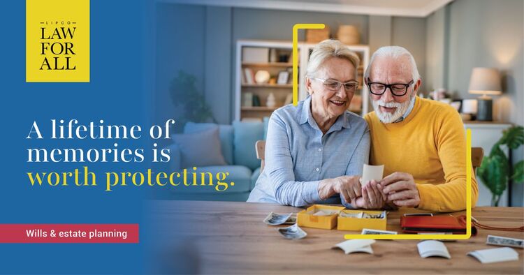 Elderly couple looking at photos and memories